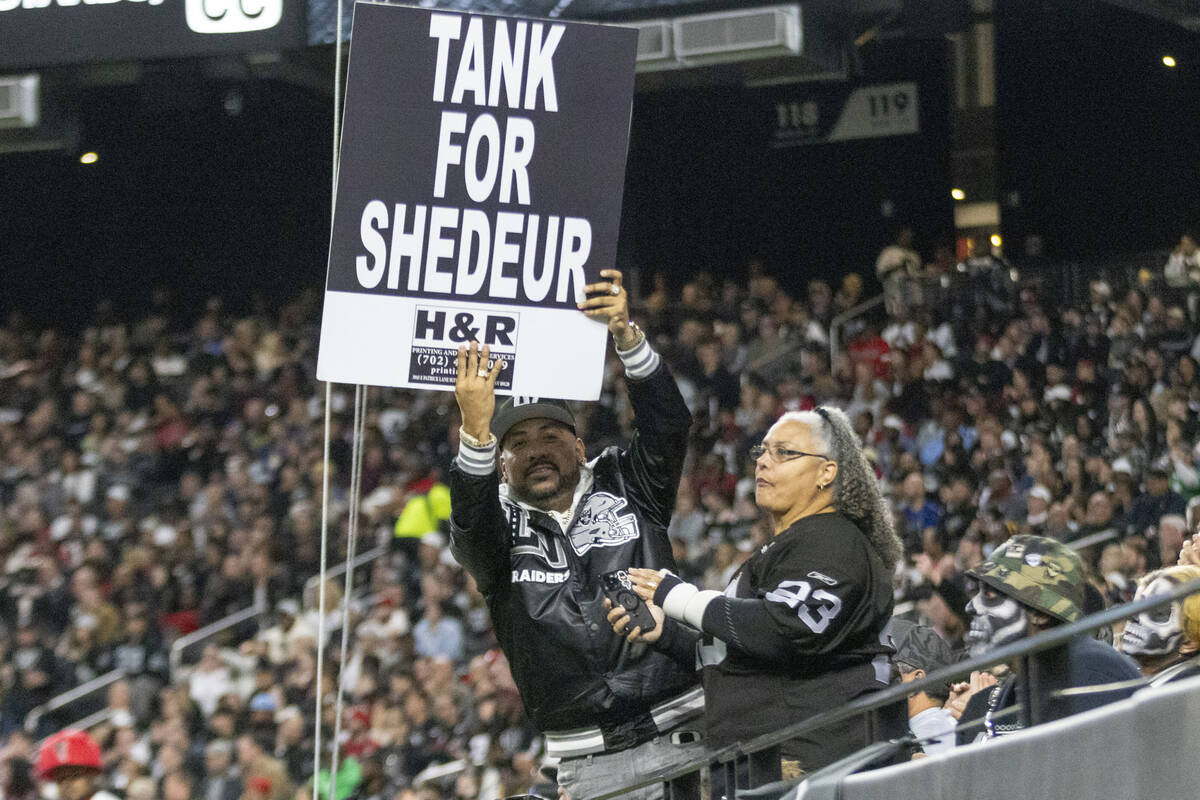 “Vegas” Ralph Sotelo holds up a sign during the first half of an NFL game between ...