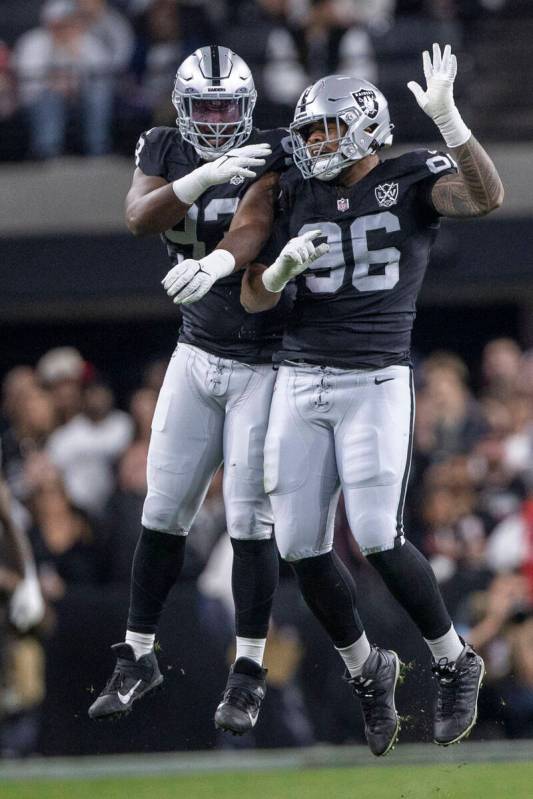 Raiders defensive tackle Jonah Laulu (96) celebrates his sack of Atlanta Falcons quarterback Ki ...