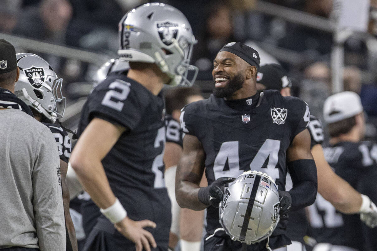 Raiders defensive end K'Lavon Chaisson (44) smiles on the sideline after a sack of Atlanta Falc ...