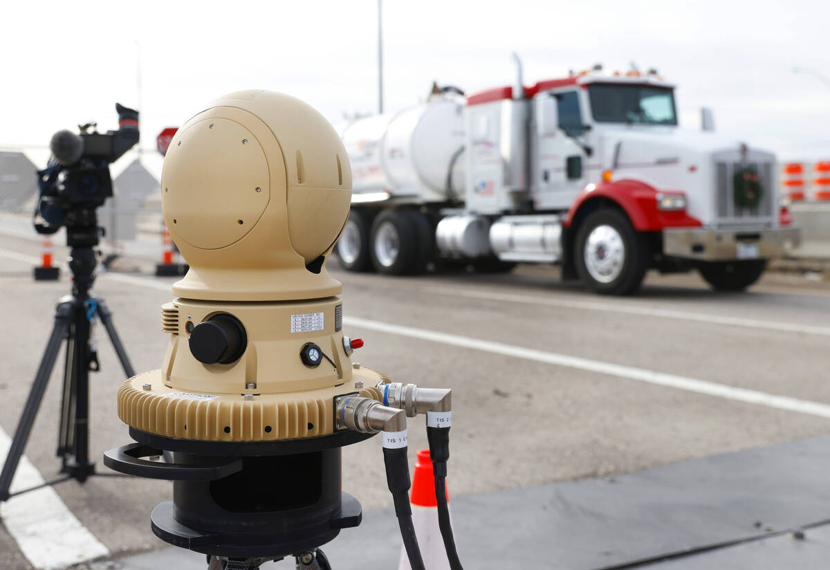 A truck drives past a thermal imaging camera at the Sloan Truck Weigh Station during a demonstr ...