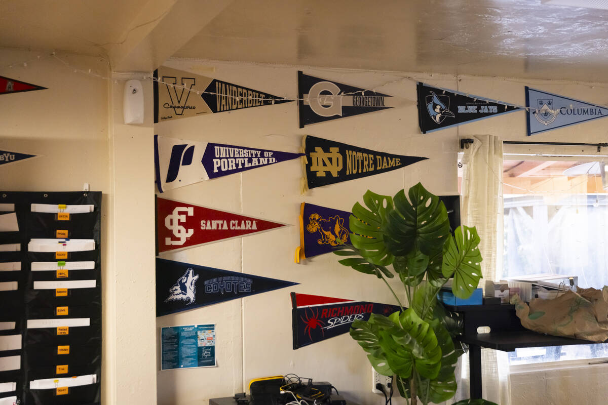 College pennants from former clients of the Inspiring Children Foundation, which assists youth ...