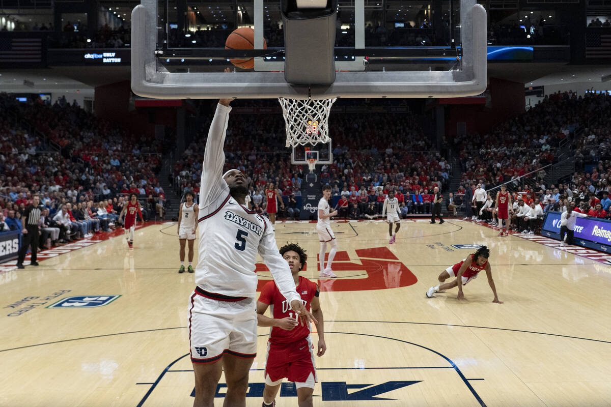 Dayton guard Posh Alexander (5) shoots against UNLV guard Dedan Thomas Jr. (11) during the firs ...