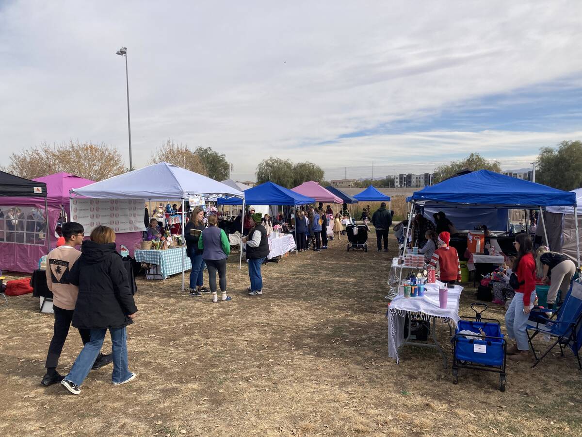 Customers browse during a Children’s Entrepreneur Market on Saturday, Dec. 14, 2024, in Hende ...