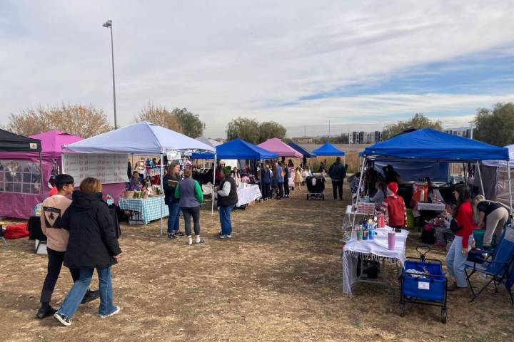 Customers browse during a Children’s Entrepreneur Market on Saturday, Dec. 14, 2024, in Hende ...