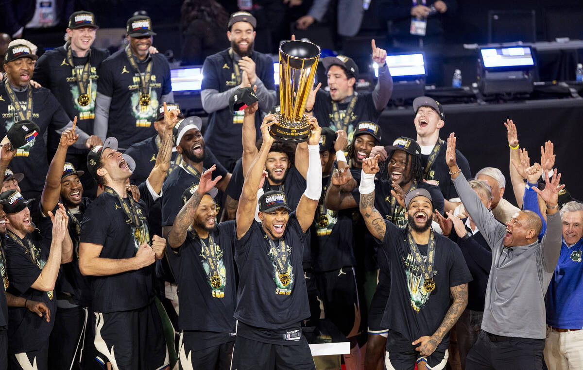 Milwaukee Bucks forward Giannis Antetokounmpo hoists the NBA Cup trophy after winning the NBA C ...