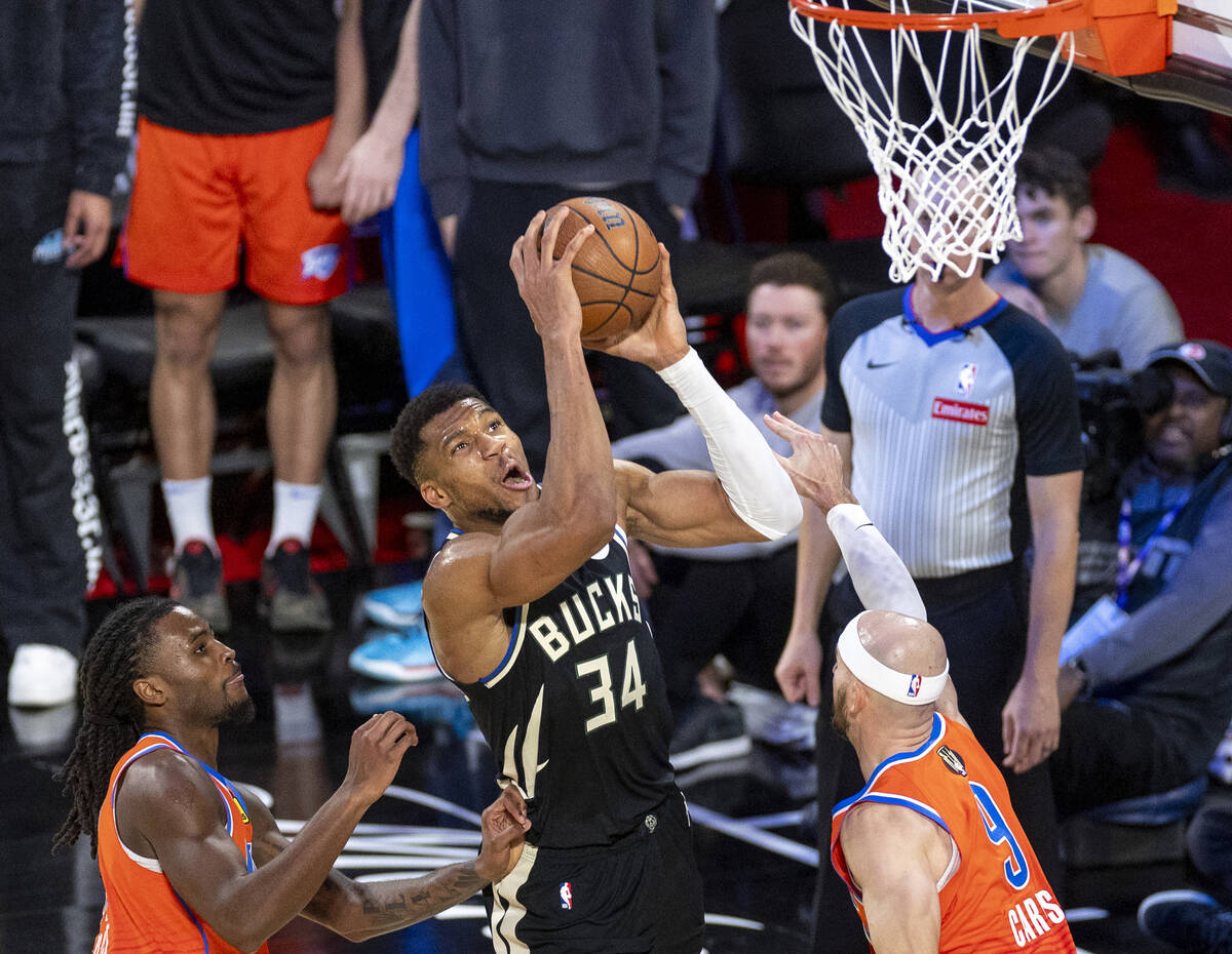 Milwaukee Bucks forward Giannis Antetokounmpo (34) jumps toward the hoop during the second half ...