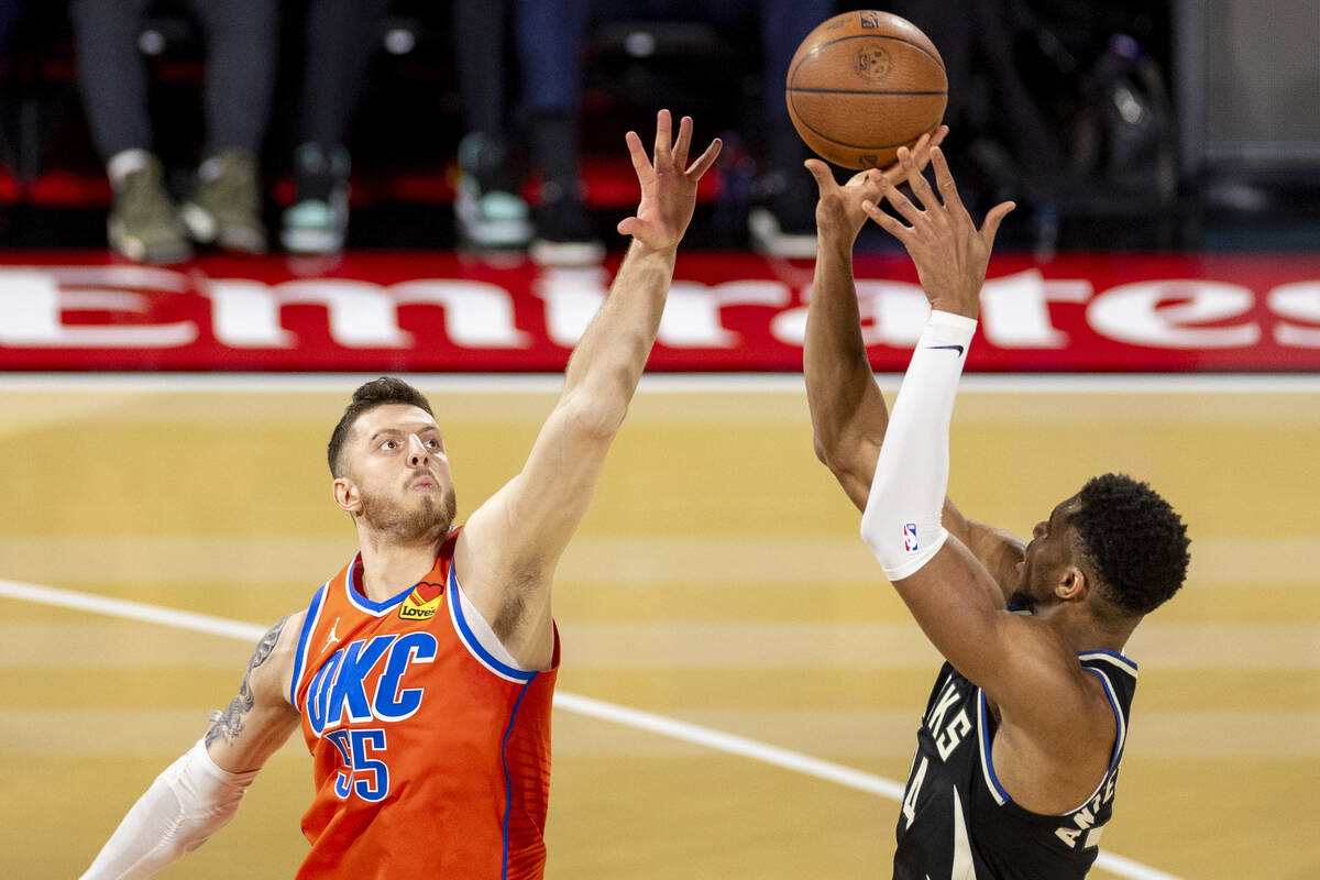 Oklahoma City Thunder center Isaiah Hartenstein (55) attempts to block a shot by Milwaukee Buck ...