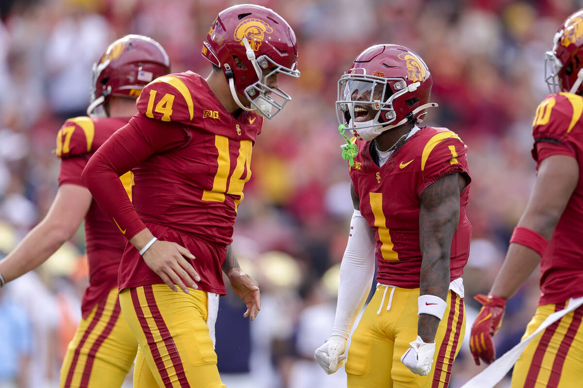 Southern California wide receiver Zachariah Branch (1) celebrates with quarterback Jayden Maiav ...