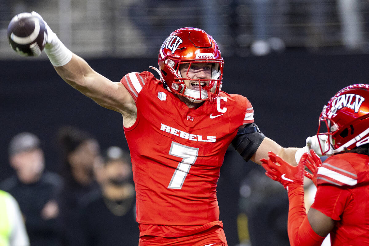 UNLV linebacker Jackson Woodard (7) celebrates after scooping a fumble and scoring a touchdown ...