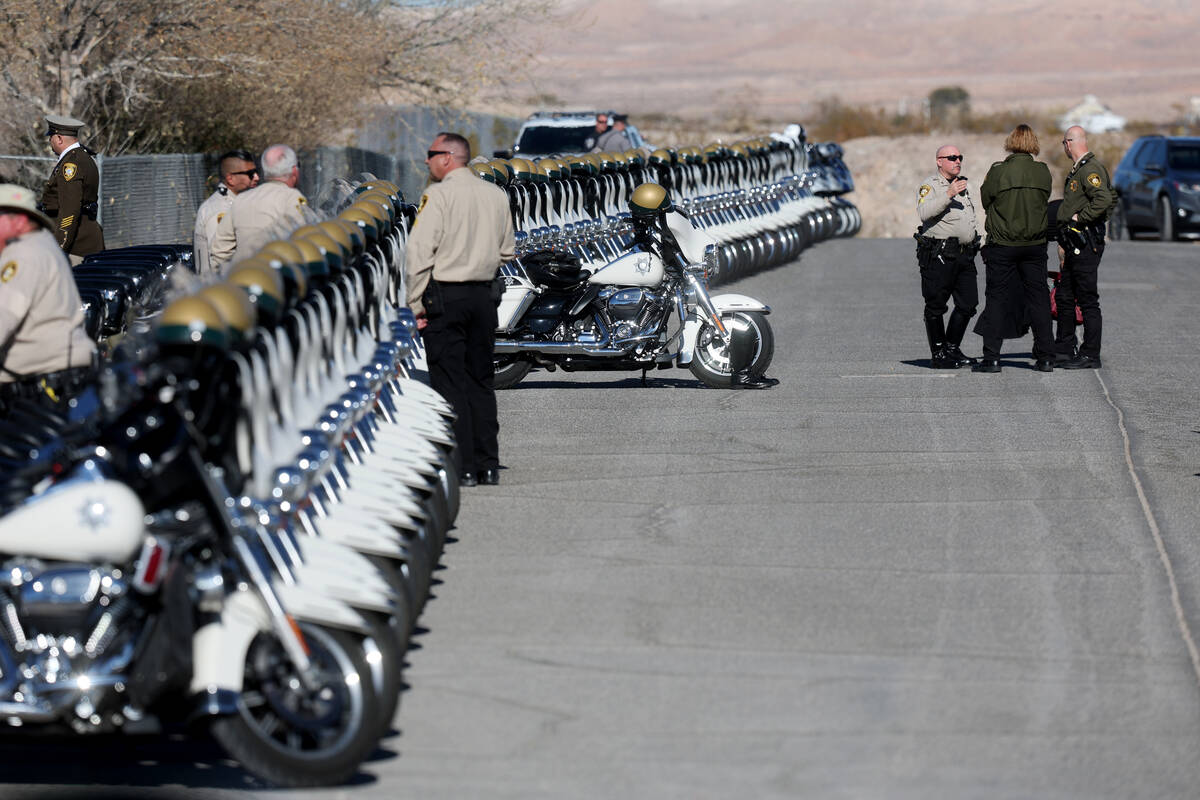 Officers gather at the motorcycle of Las Vegas police officer Colton Pulsipher during funeral s ...