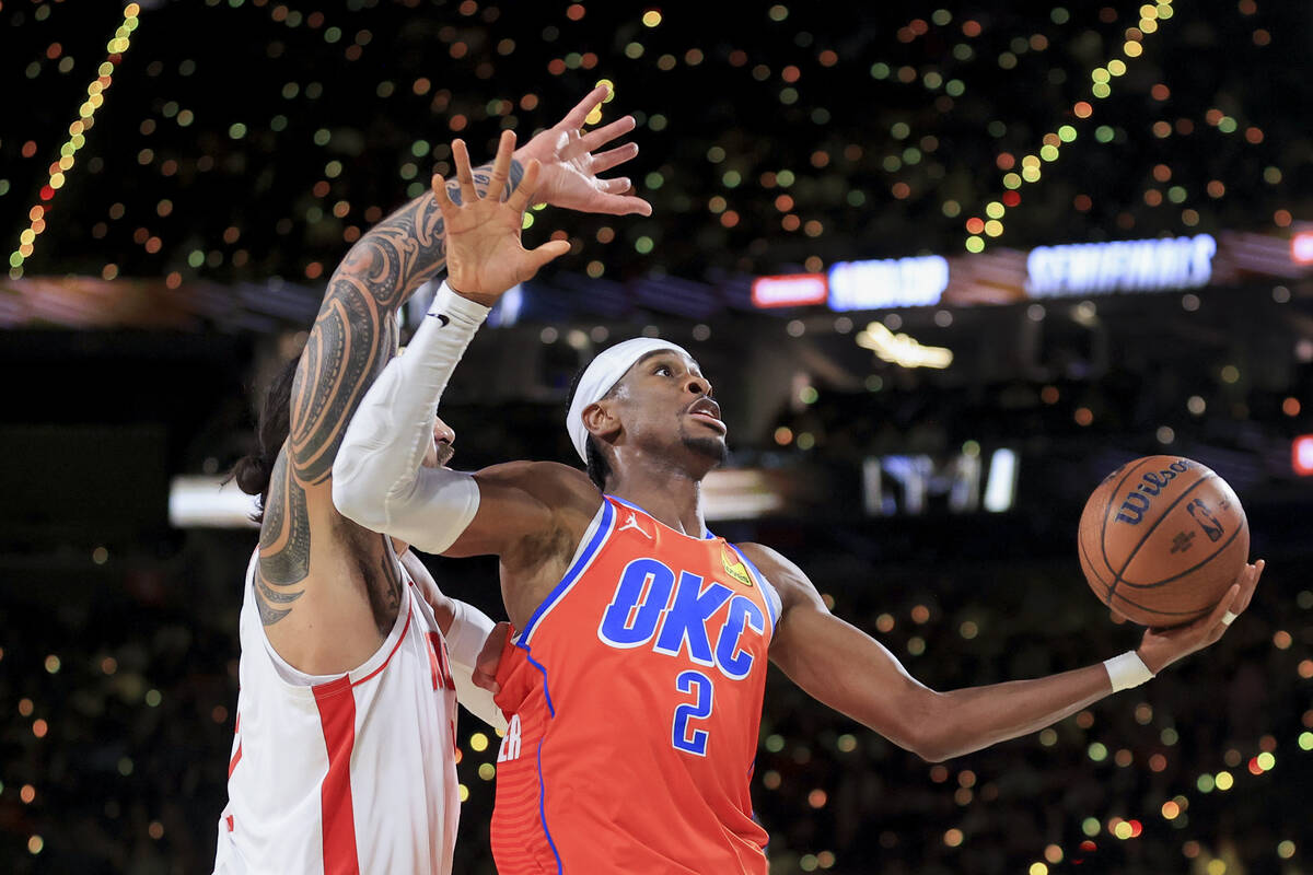 Oklahoma City Thunder guard Shai Gilgeous-Alexander (2) looks to shoot against Houston Rockets ...