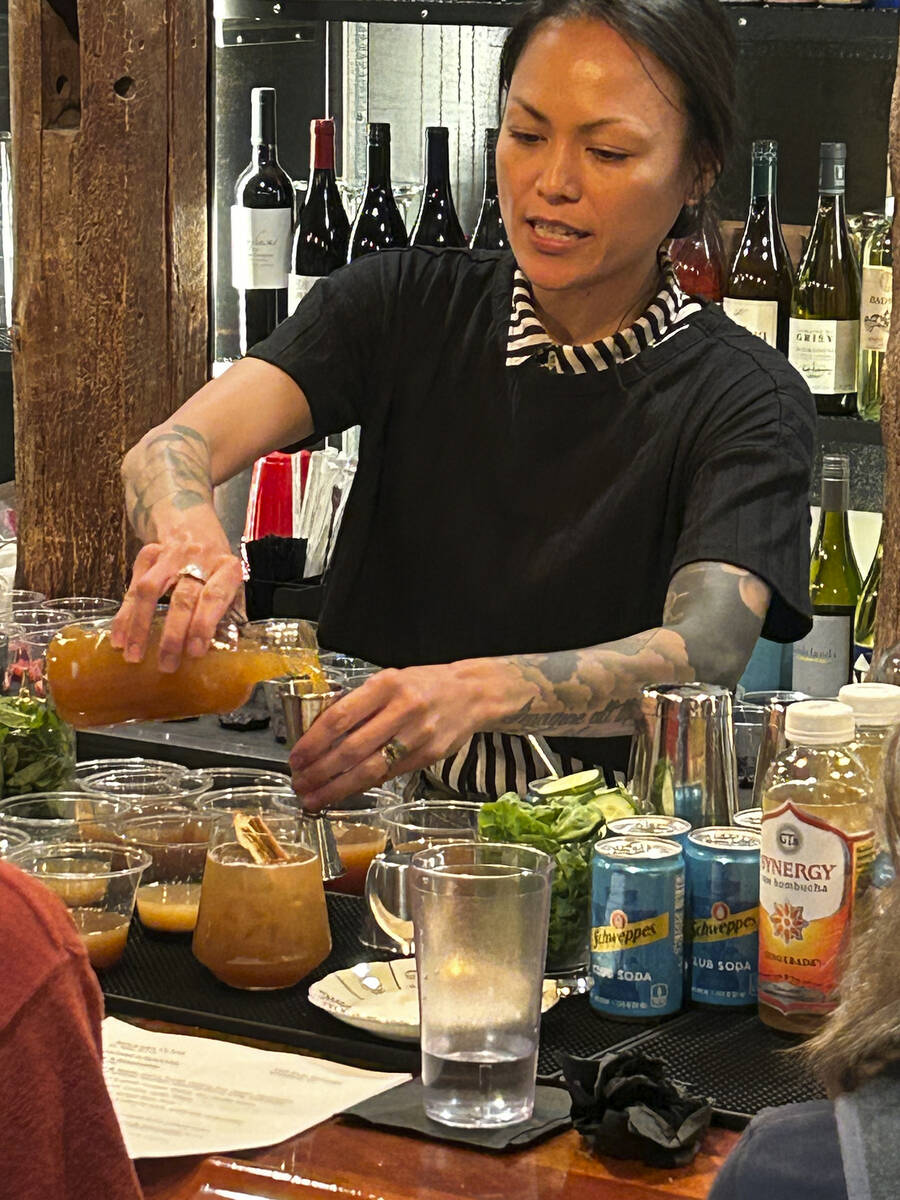 Bartender Patty Burns makes a drink called the Fall Apple Spritz, made with a spiced simple syr ...