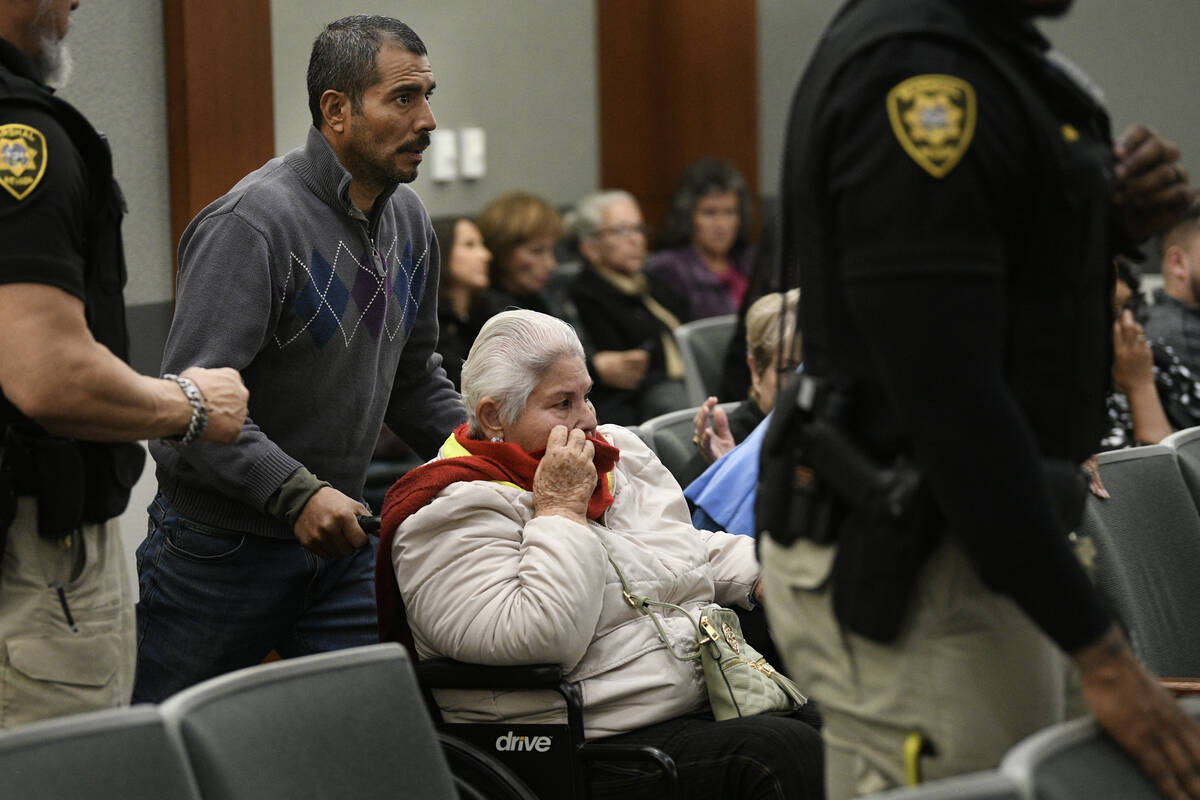 Daniel Omezcua assists Maria Pasarin in her wheelchair as they appear in Las Vegas Justice Cour ...