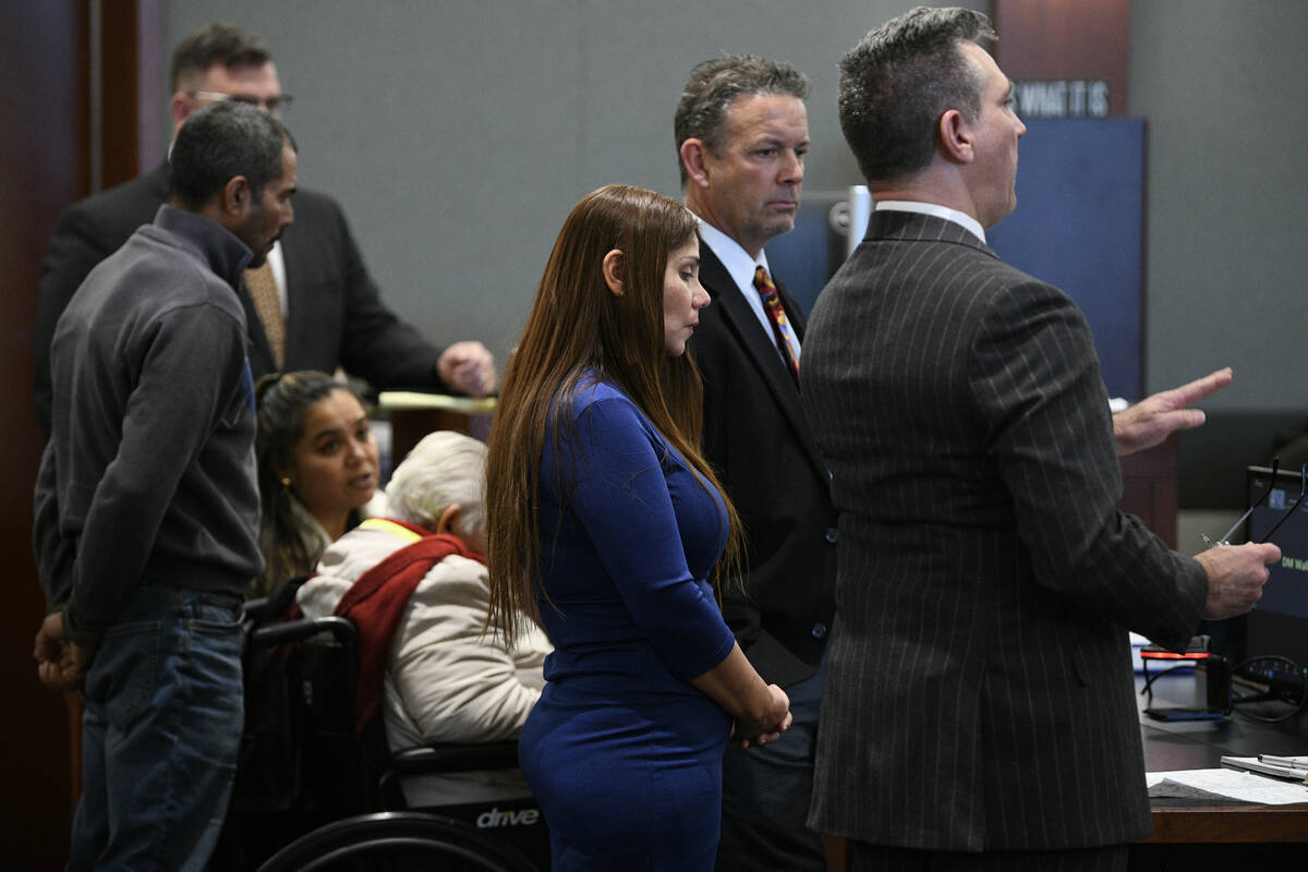 Addy Gonzales, center, listens as her lawyer speaks during sentencing in Las Vegas Justice Cour ...