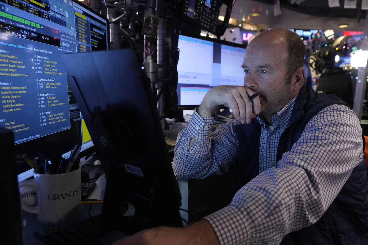 Trader Peter Mancuso works on the floor of the New York Stock Exchange, Wednesday, Dec. 18, 202 ...