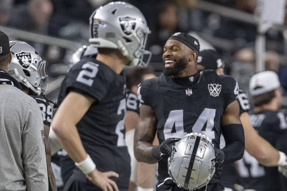 Raiders defensive end K'Lavon Chaisson (44) smiles on the sideline after a sack of Atlanta Falc ...