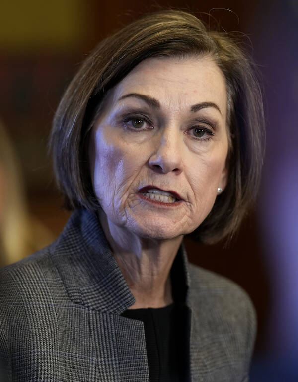 FILE - Iowa Gov. Kim Reynolds speaks during a news conference, Jan. 31, 2024, at the Statehouse ...