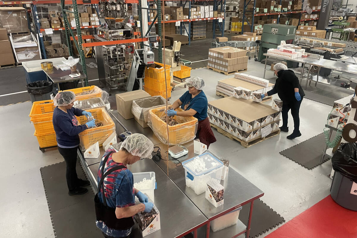 Employees of Kimmie Candy pack products at the manufacturing facility in Reno, Nevada. (Courtes ...