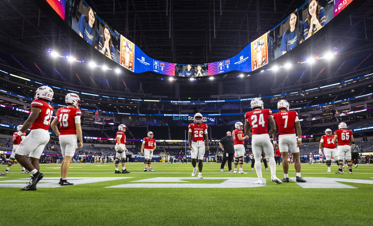 UNLV players warm up before the start of the LA Bowl NCAA college football game against Cal at ...