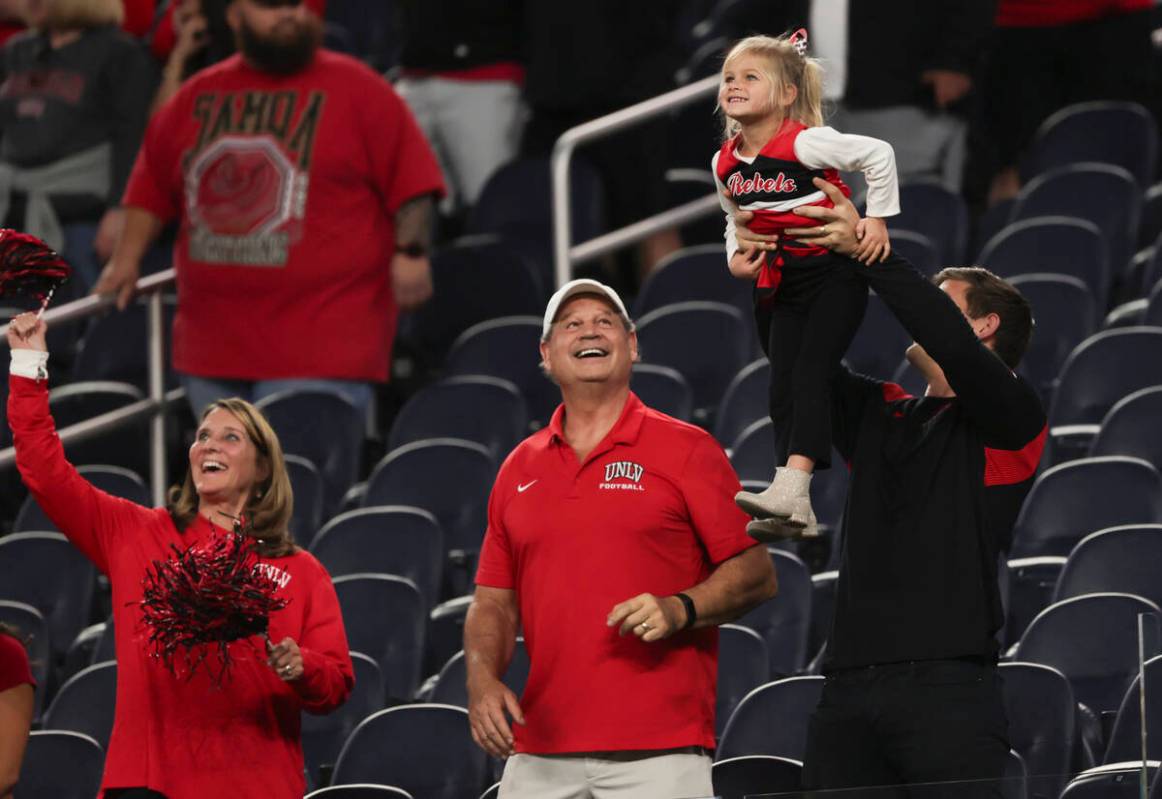 UNLV fans react for a video camera before the start of the LA Bowl NCAA college football game a ...