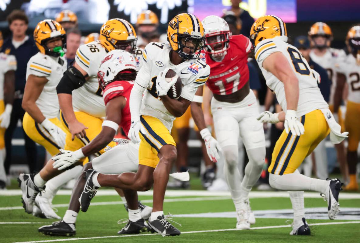 Cal wide receiver Josiah Martin (17) gets past UNLV defense to score a touchdown during the fir ...