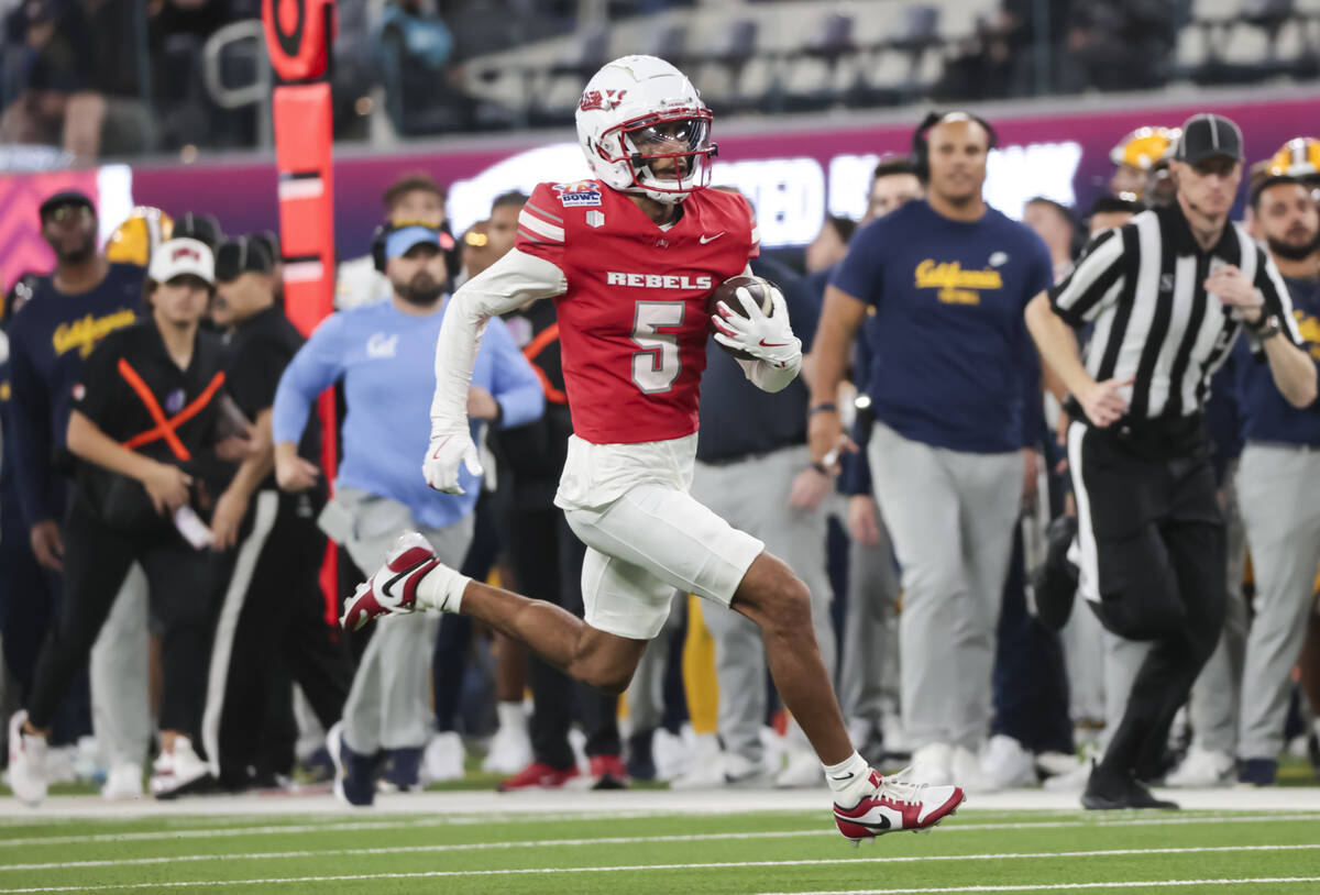 UNLV defensive back Cameron Oliver (5) runs the ball against Cal after a fake punt during the f ...