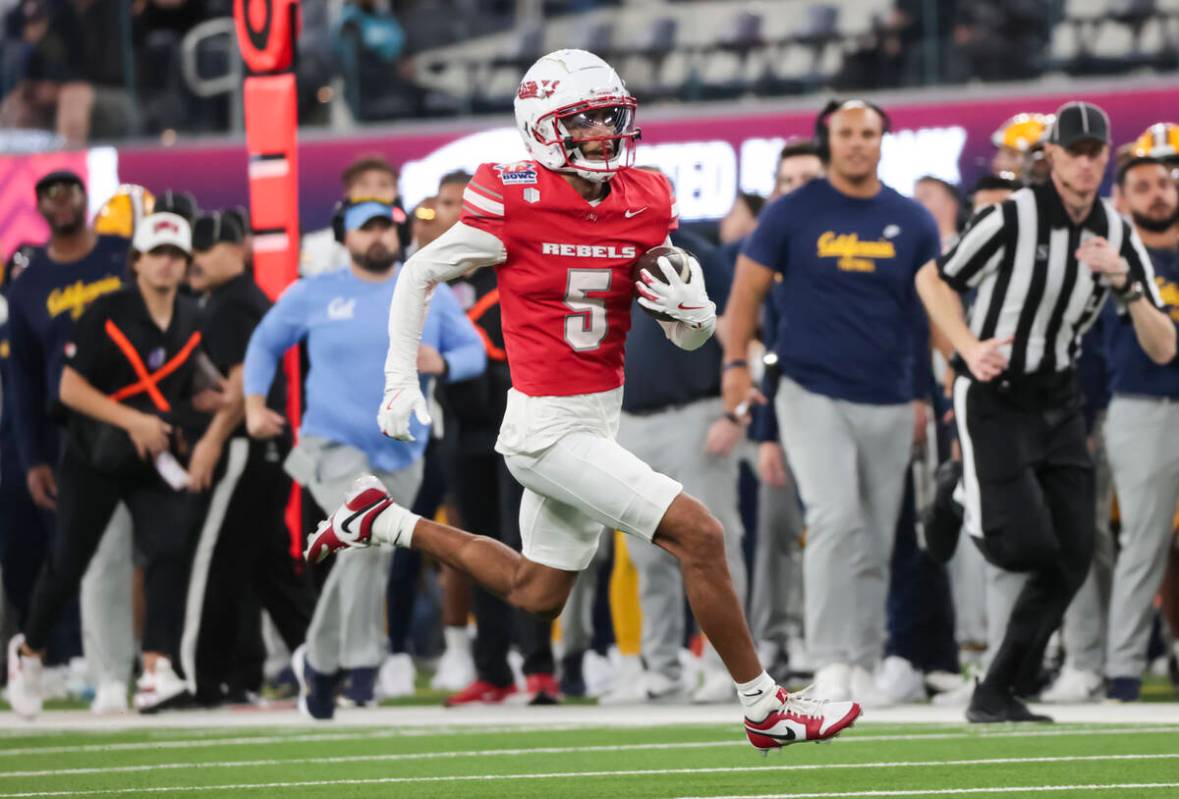 UNLV defensive back Cameron Oliver (5) runs the ball against Cal after a fake punt during the f ...