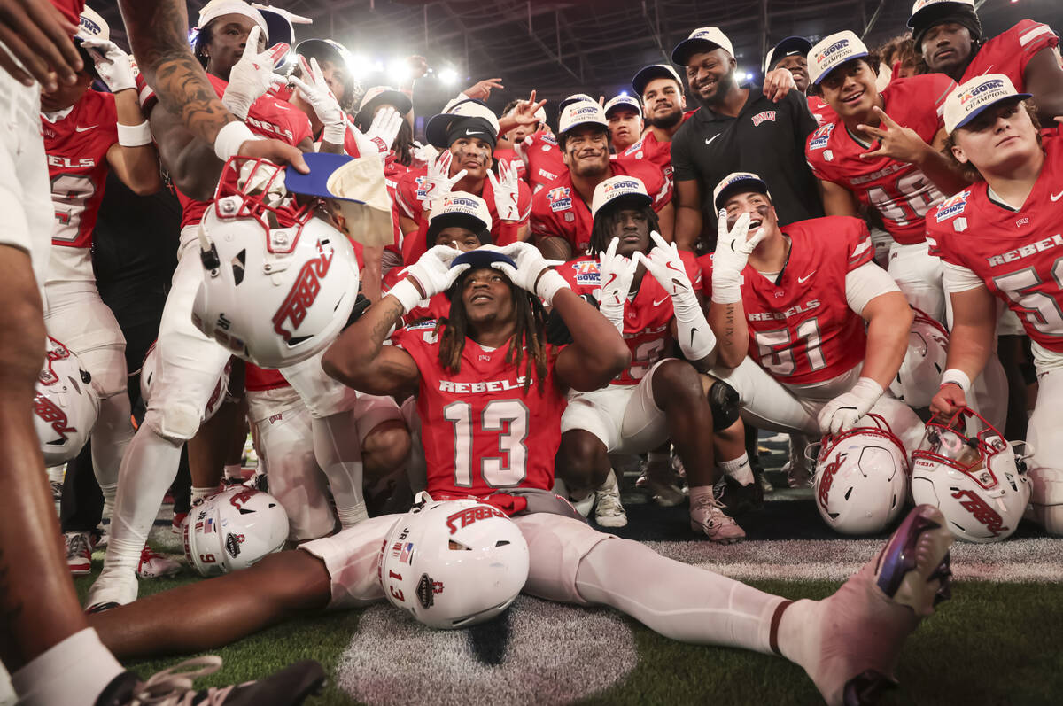 UNLV defensive back Jarvis Ware (13) puts on a hat after defeating Cal in the LA Bowl at SoFi S ...