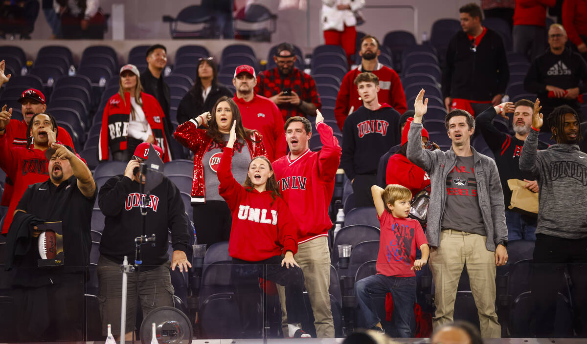 UNLV fans celebrate after the team defeated Cal in the LA Bowl NCAA college football game at So ...