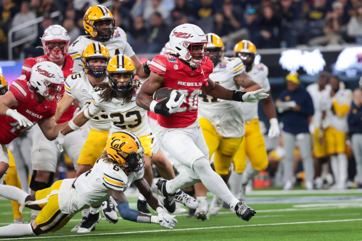 UNLV running back Kylin James (20) runs the ball against Cal during the second half of the LA B ...