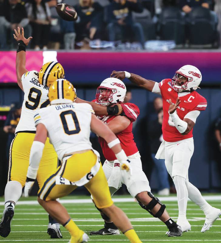 UNLV quarterback Hajj-Malik Williams (6) throws a pass during the first half of the LA Bowl NCA ...