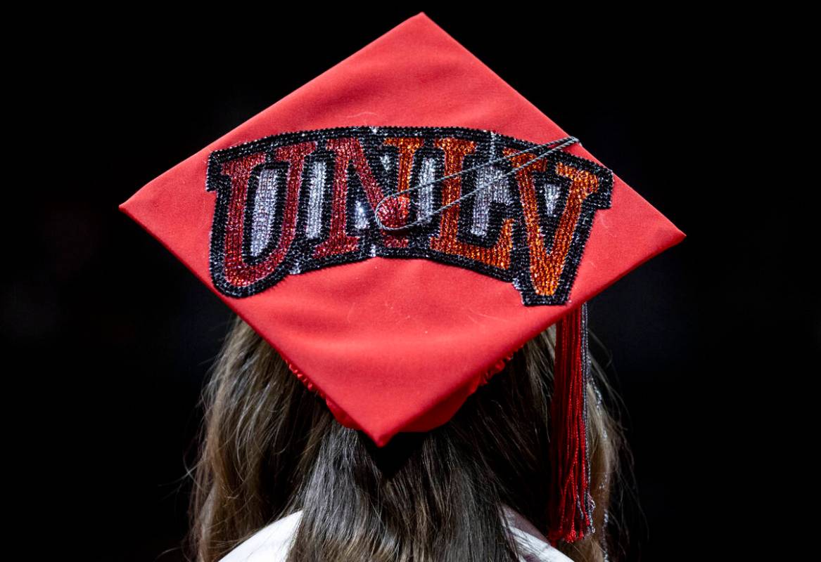 A graduate listens during the UNLV winter commencement at the Thomas & Mack Center, Wednesd ...