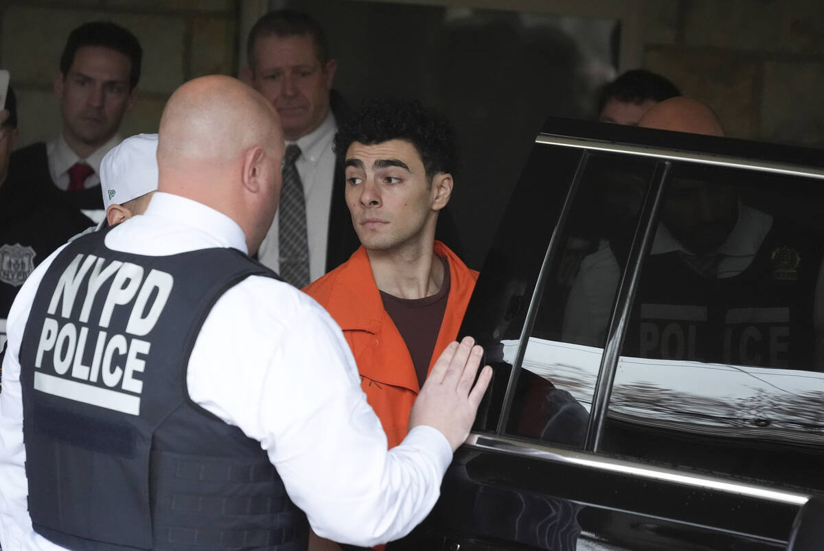 Luigi Nicholas Mangione leaves at Blair County Courthouse in Hollidaysburg, Pa., Thursday, Dec. ...