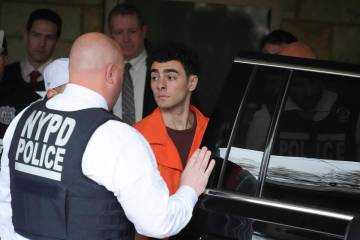 Luigi Nicholas Mangione leaves at Blair County Courthouse in Hollidaysburg, Pa., Thursday, Dec. ...