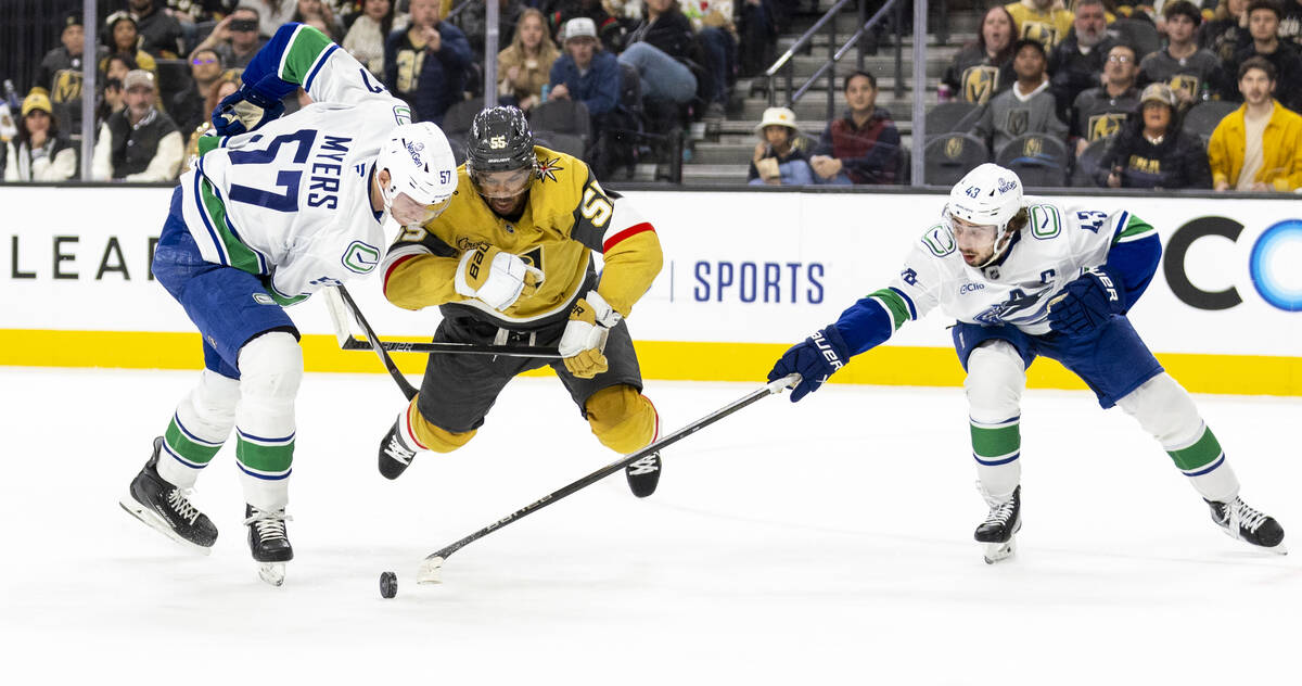 Golden Knights right wing Keegan Kolesar (55) flies in the air after tripping next to Vancouver ...