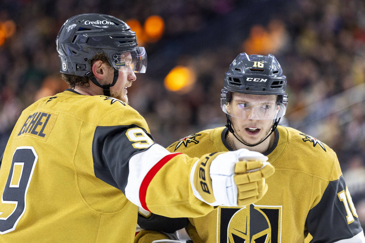 Golden Knights center Jack Eichel (9) talks to left wing Pavel Dorofeyev (16) before a face-off ...