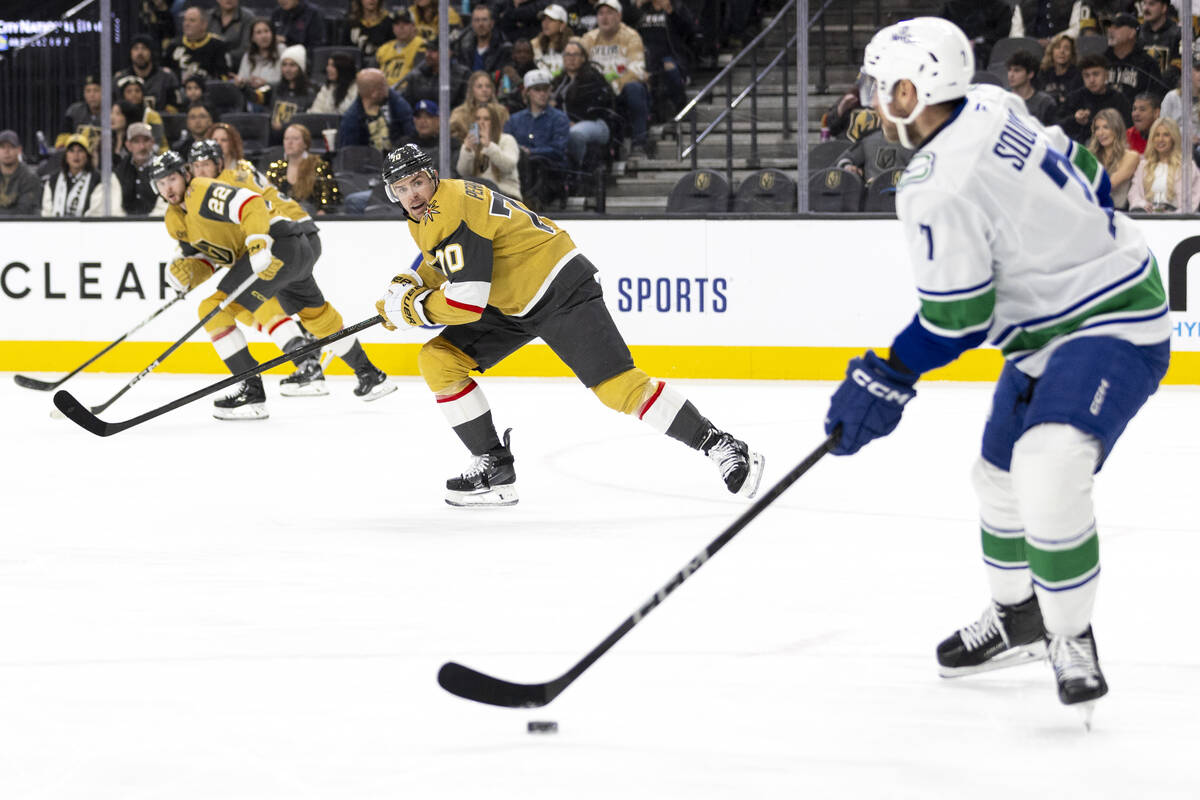 Golden Knights left wing Tanner Pearson (70) watches Vancouver Canucks defenseman Carson Soucy ...