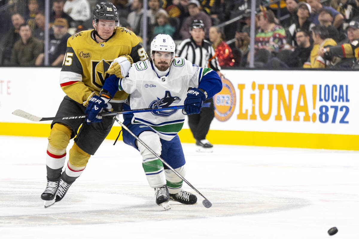 Golden Knights right wing Victor Olofsson (95) and Vancouver Canucks right wing Conor Garland ( ...