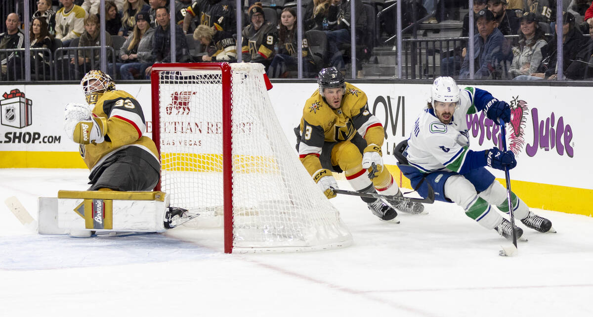 Golden Knights defenseman Brayden McNabb (3) chases after Vancouver Canucks center J.T. Miller ...