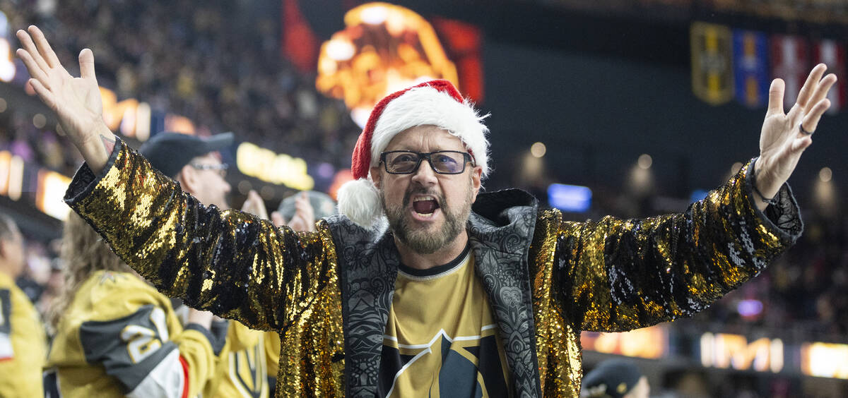 A Golden Knights fan cheers after Golden Knights defenseman Alex Pietrangelo, not pictured, sco ...