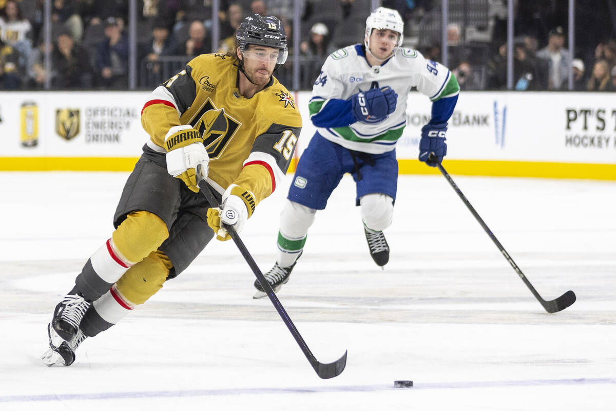 Golden Knights defenseman Noah Hanifin (15) controls the puck during the third period of the NH ...