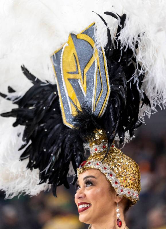 A Vegas Belle dances before the NHL hockey game between the Vancouver Canucks and Golden Knight ...