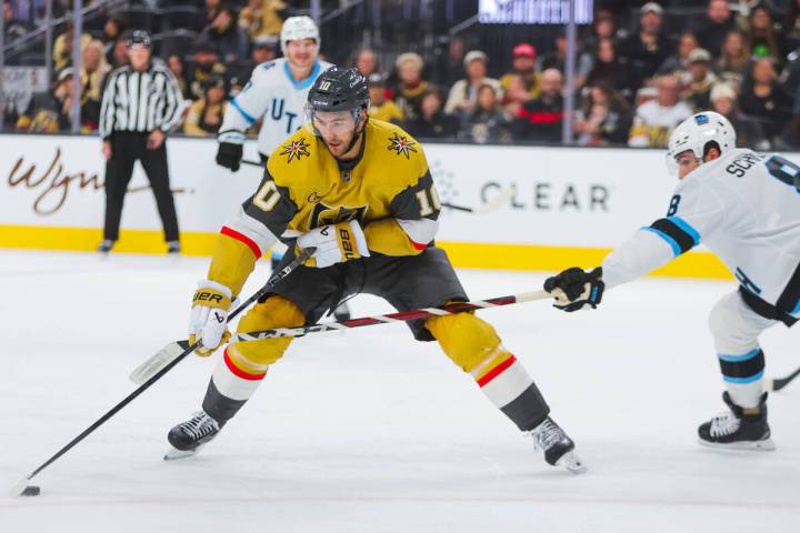 Golden Knights center Nicolas Roy (10) reaches for the puck during an NHL hockey game between t ...