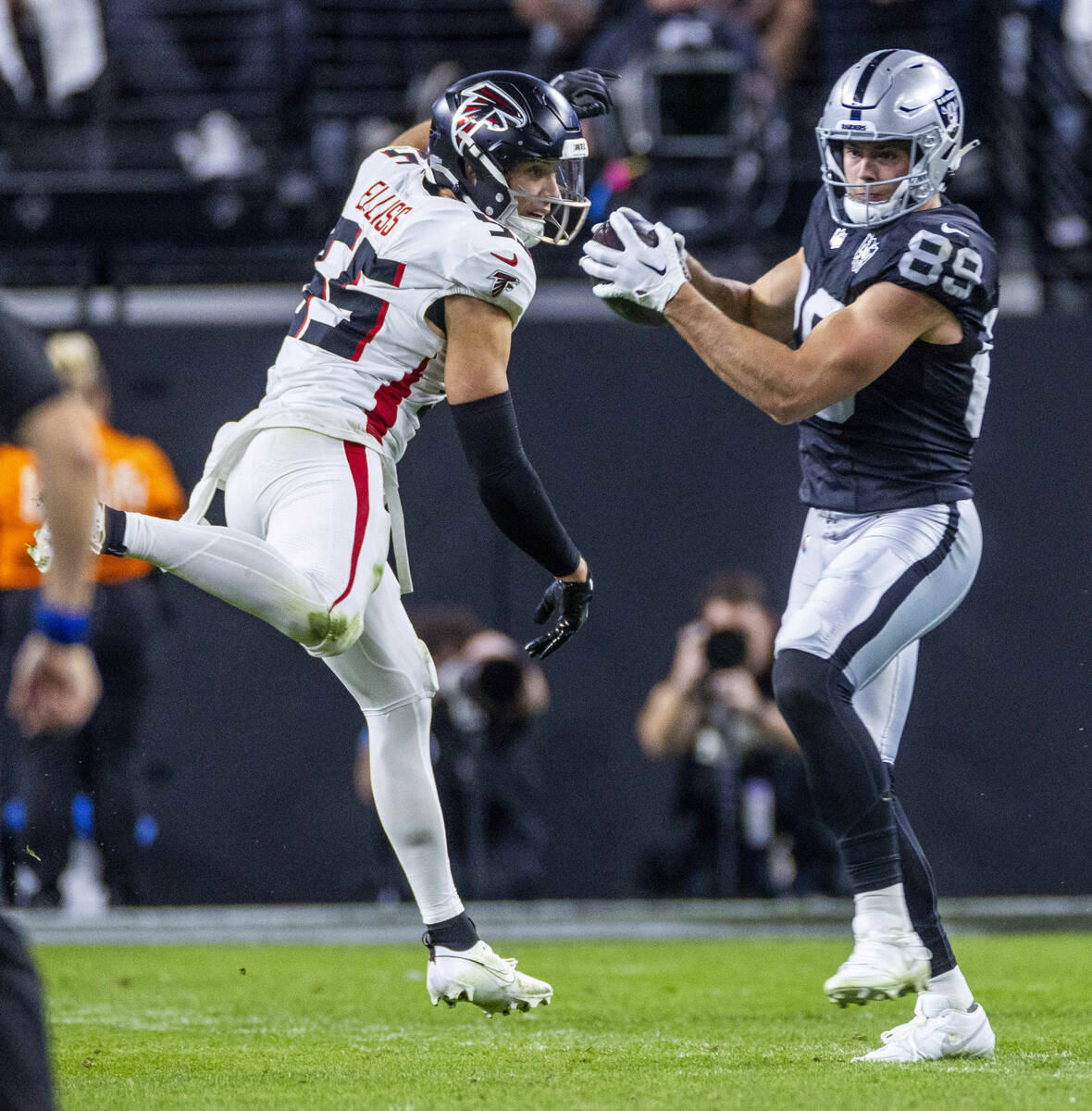 Raiders tight end Brock Bowers (89) makes a reception as Atlanta Falcons linebacker Kaden Ellis ...