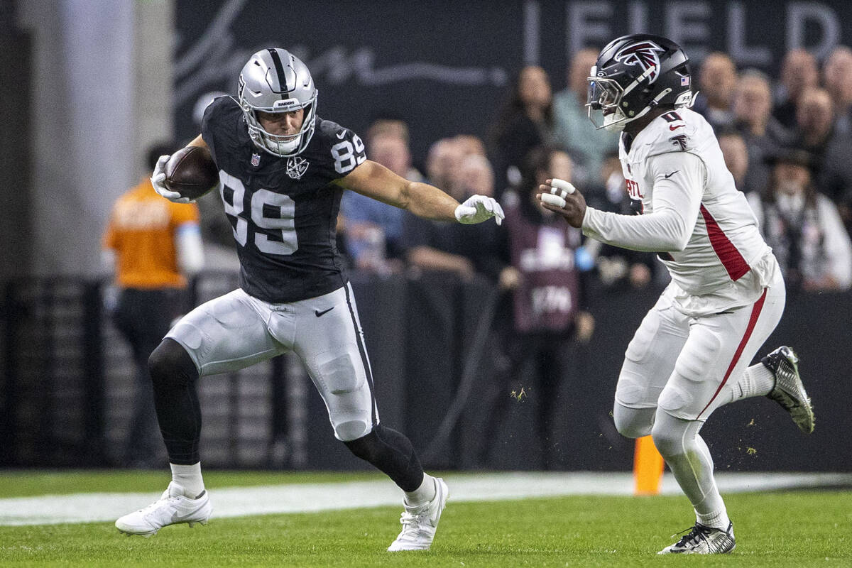 Raiders tight end Brock Bowers (89) runs after the catch with Atlanta Falcons linebacker Lorenz ...