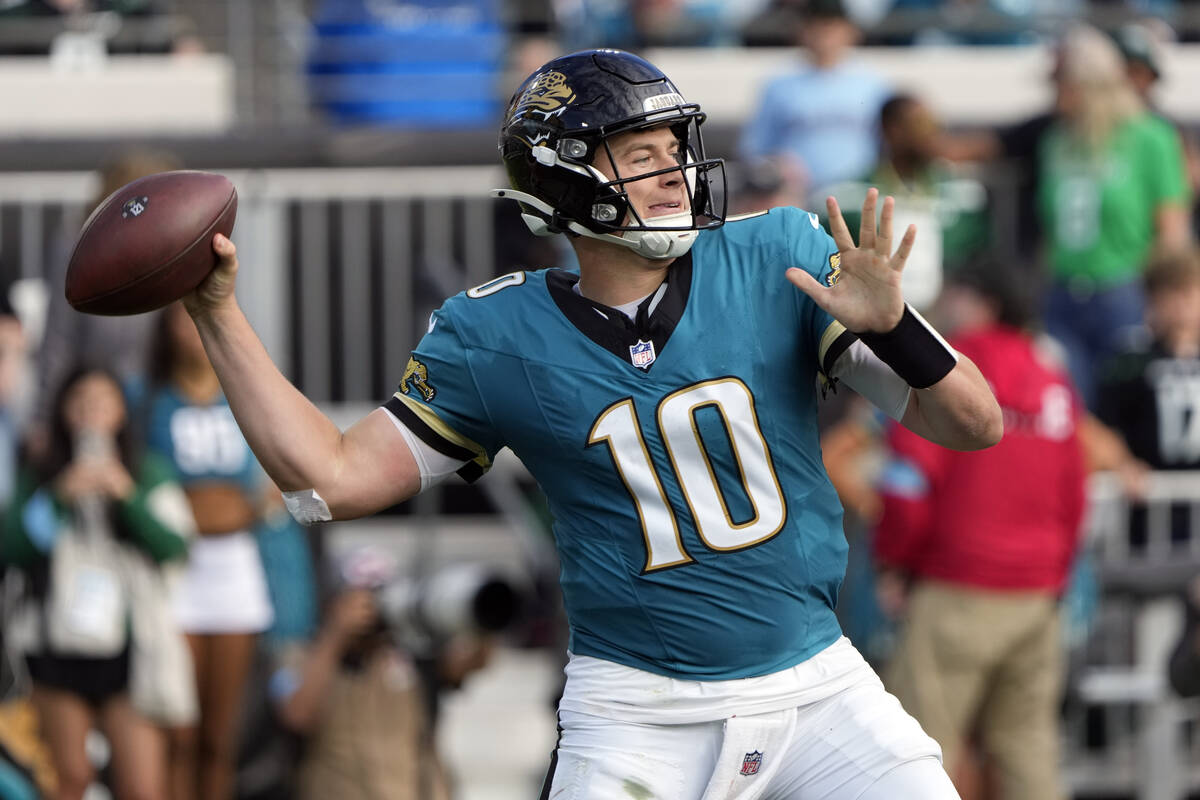 Jacksonville Jaguars quarterback Mac Jones (10) throws a pass during the second half of an NFL ...