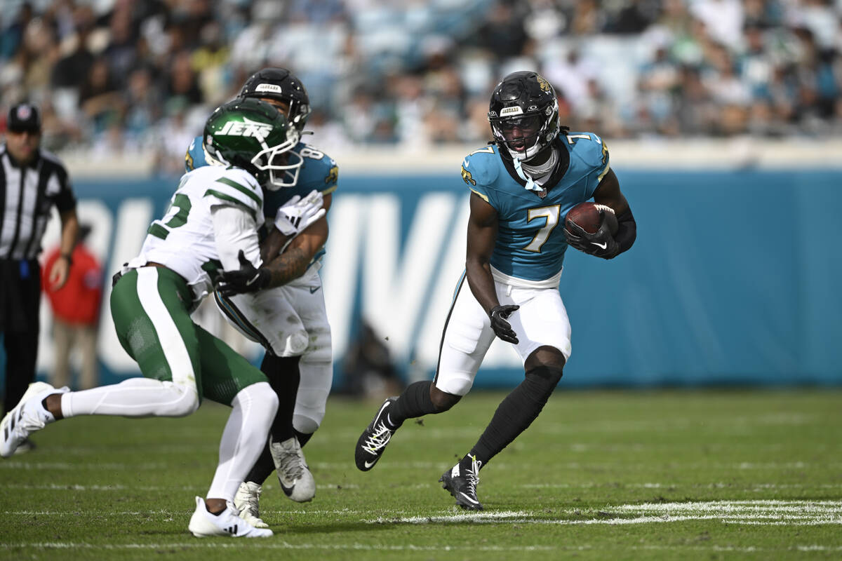 Jacksonville Jaguars wide receiver Brian Thomas Jr. (7) runs after catching a pass against the ...