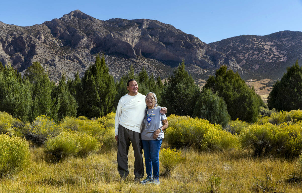 Delaine and Rick Spilsbury stand among Bahsahwahbee, a grove of Rocky Mountain juniper trees lo ...