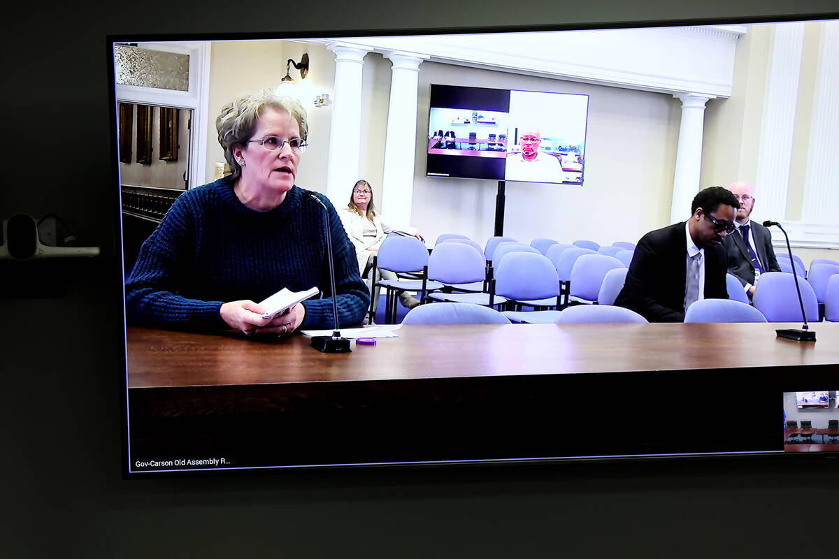 Tammy Berg, right, speaks from Carson City during the public comment period of a Board of State ...