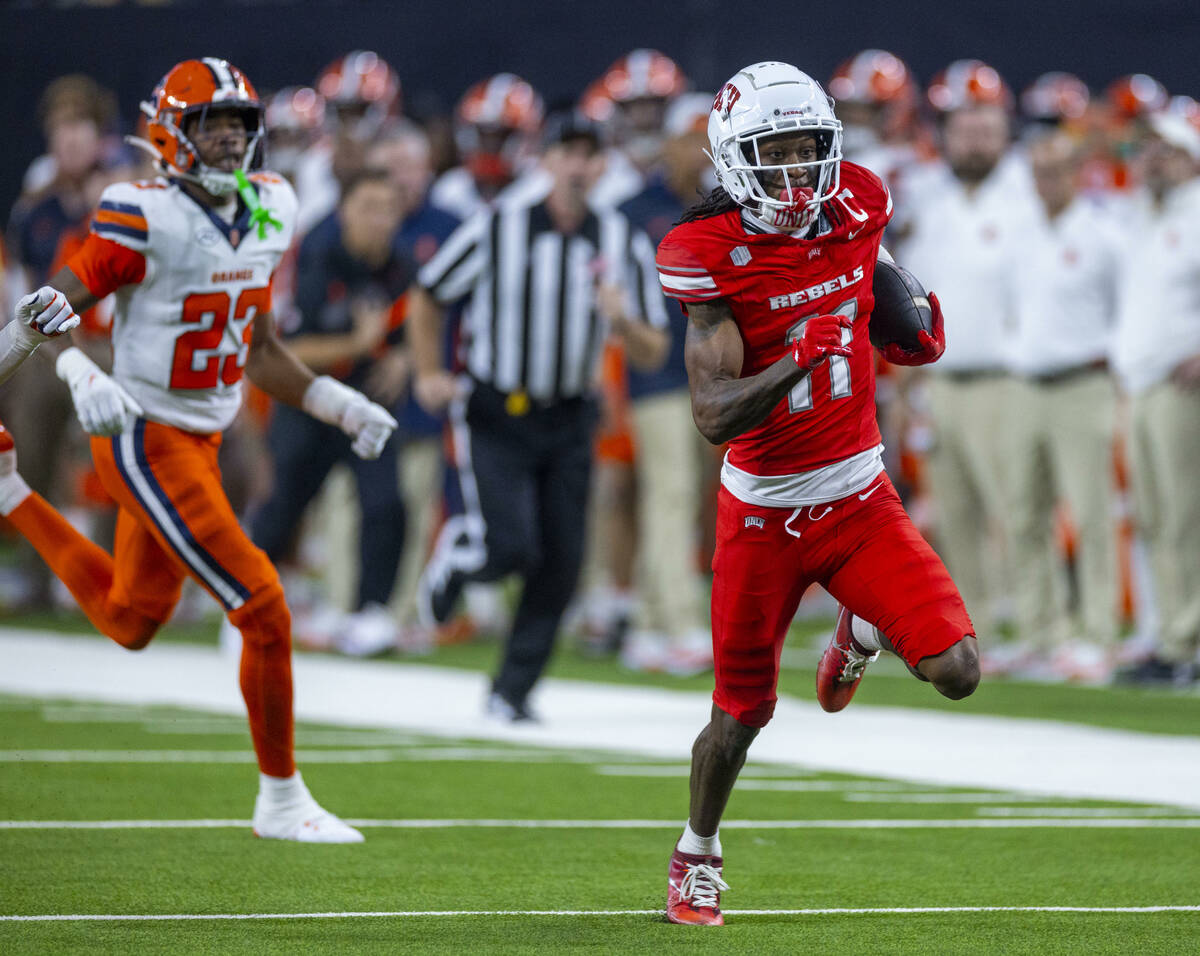 UNLV wide receiver Ricky White III (11) sprints down the field as Syracuse Orange defensive bac ...